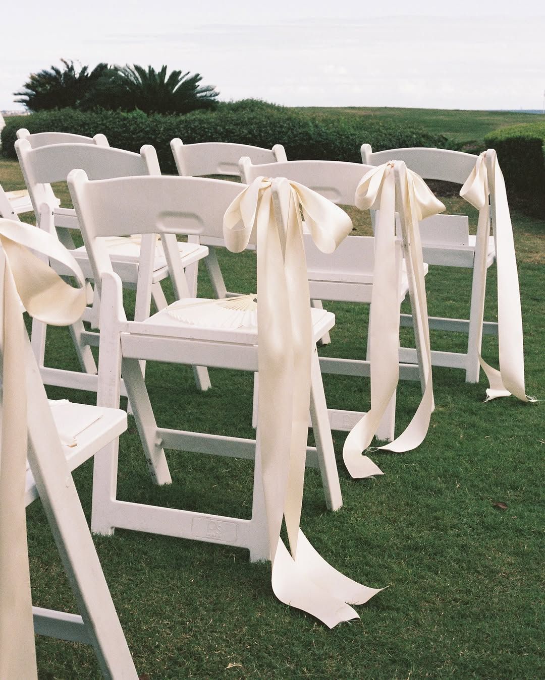 White Resin Chairs & Chair Sashes